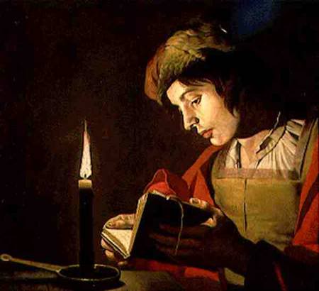 young_man_reading_candle_ligh_hi
